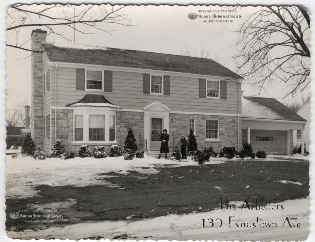 Christmas card of George & Lois Arbeiter showing their children Janice, Judy, and George in front of their home at 139 S. Evanslawn early or mid-1950s (Aurora Historical Society Photo)